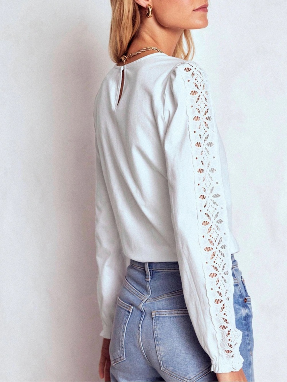 Boden white embroidered long sleeve top.